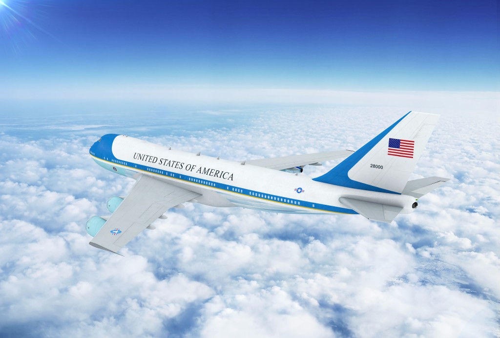Air Force One, a Boeing 747, flying over cloud